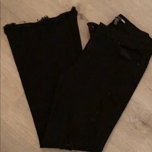 Distressed wide leg black jeans
